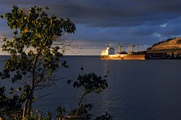 Cargo-ship;-Comoros-Archipelago;-Evening-light;-France;-Indian-Ocean;-Kaleidos;-Kaleidos-images;-La-parole-à-limage;-Laurent-Abad;-Longoni;-Mayotte;-Port;-Quay;-Sea;-Ship;-Stories-Pictures